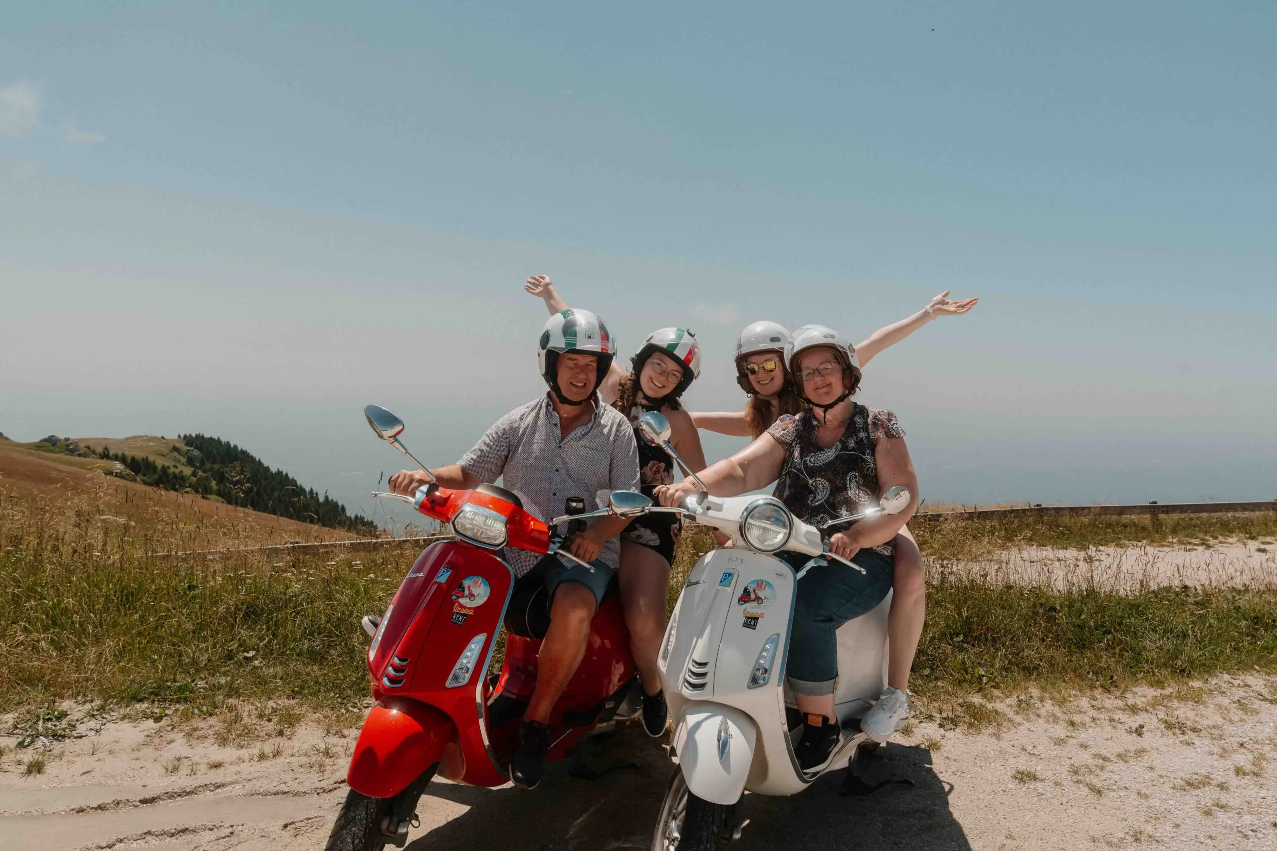 group of happy people doing the vespa trip dolomiti